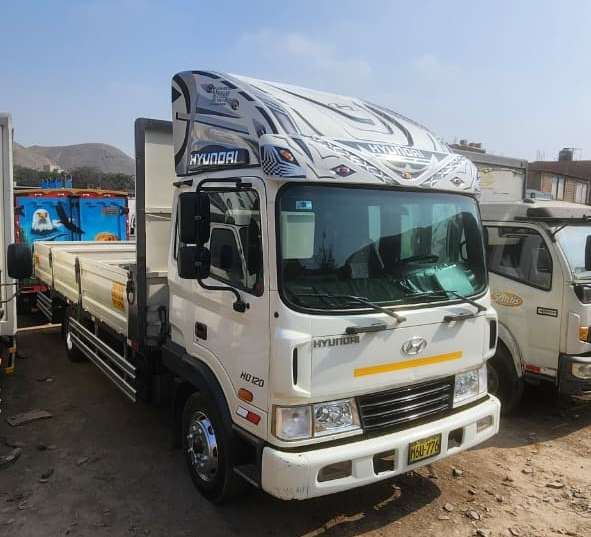 Transporte de carga con baranda rebatible - Transportes JM